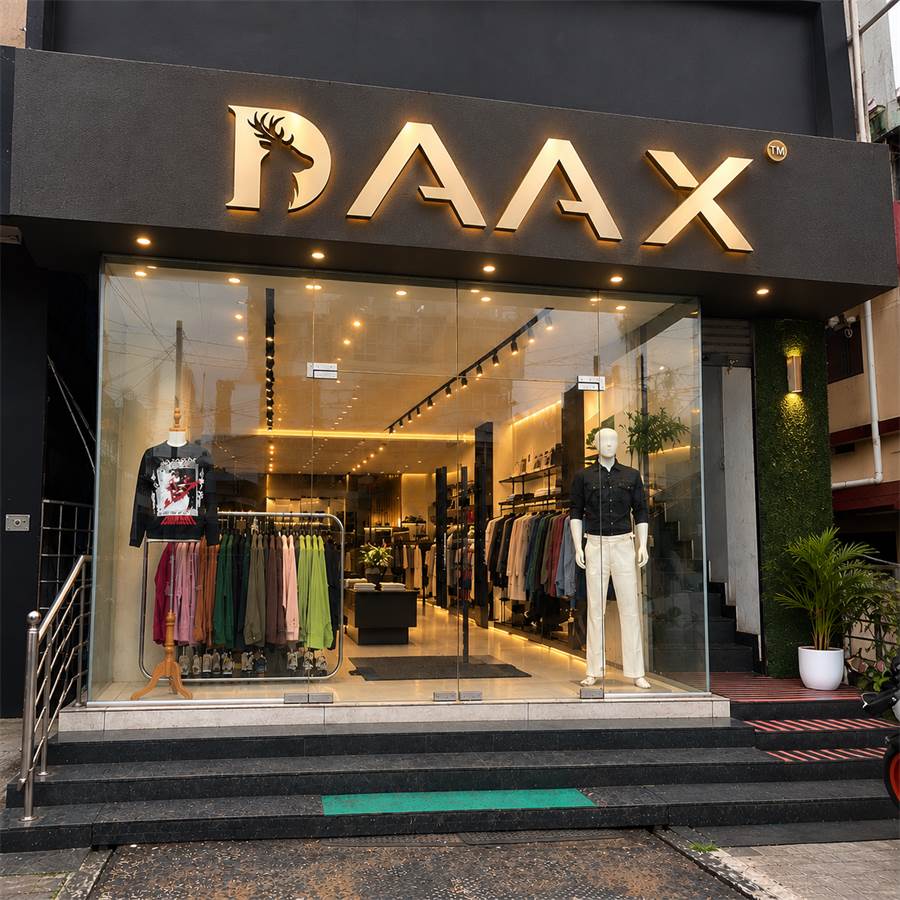 DAAX Clothing Store Thrissur storefront at night